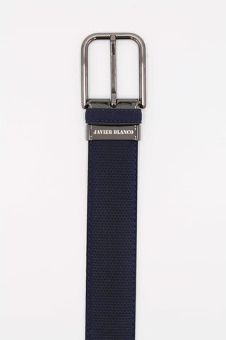 Navy honeycomb leather belt with brand name engraved on the buckle.