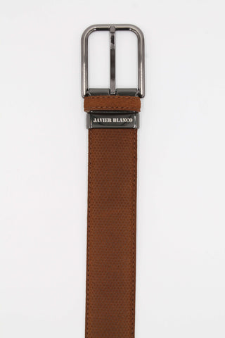 Tan honeycomb leather belt with brand name engraved on the buckle.
