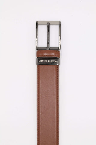 Tan leather belt with brand name engraved on the buckle.