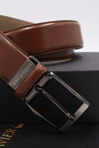 Tan leather belt buckle details.